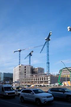 On a large construction site are several construction cranes Stock Photos