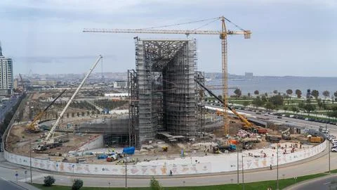 A large construction site with a crane in the background Stock-Fotos
