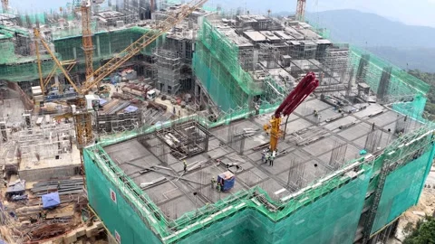 Large Construction Site With Cranes and Buildings on a Mountain Landscape, .. Stock Footage 320508476