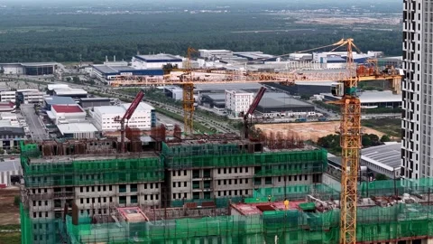 Large construction site with cranes and industrial building under development Stock Footage 336948744