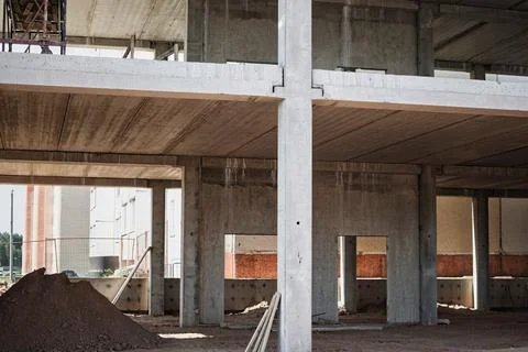 Large construction site featuring a multi-level concrete framework with piles Stock Photos