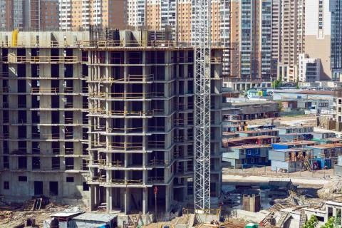 Large construction site including crane working on a building complex Stock Photos