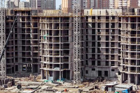 Large construction site including crane working on a building complex Stock Photos
