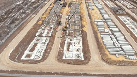 Large construction site including several excavators and cranes Stock Footage 120846943