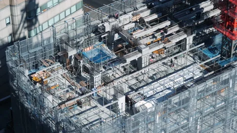 Large construction site including several workers working on a building complex. Stock Footage 139060091