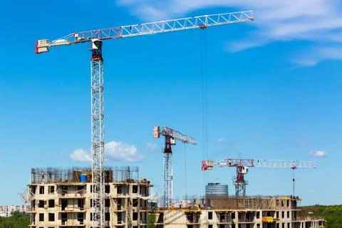 Large construction site including several cranes working on a building complex Stock Photos