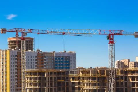 Large construction site including several cranes working on a building complex Stock Photos