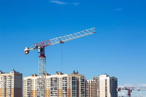 Large construction site including several cranes working on a building complex Stock Photos