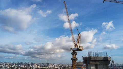 Large construction site including several cranes working on a building comple Stock Photos