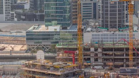 Large construction site with many working cranes timelapse. Fotos Stock