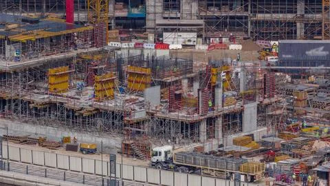 Large construction site with many working cranes timelapse. Fotos Stock