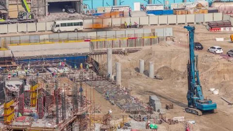 Large construction site with many working cranes timelapse. Stock-Fotos