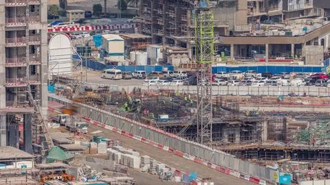 Large construction site with many working cranes timelapse. Fotos Stock