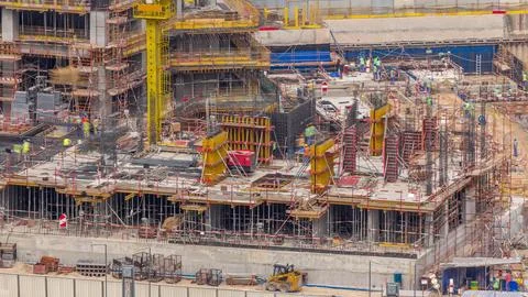 Large construction site with many working cranes timelapse. Stock-Fotos