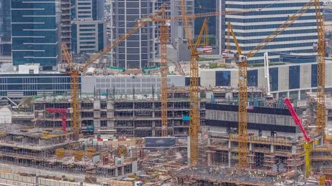 Large construction site with many working cranes timelapse. Stock-Fotos