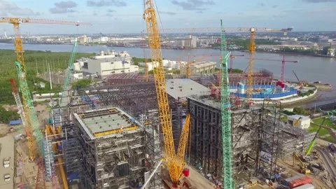 Large construction site with multiple cranes building a power plant Stock-Footage 312390418