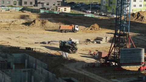 Large construction site with sand foundation pit and cranes Stock Footage 130368289