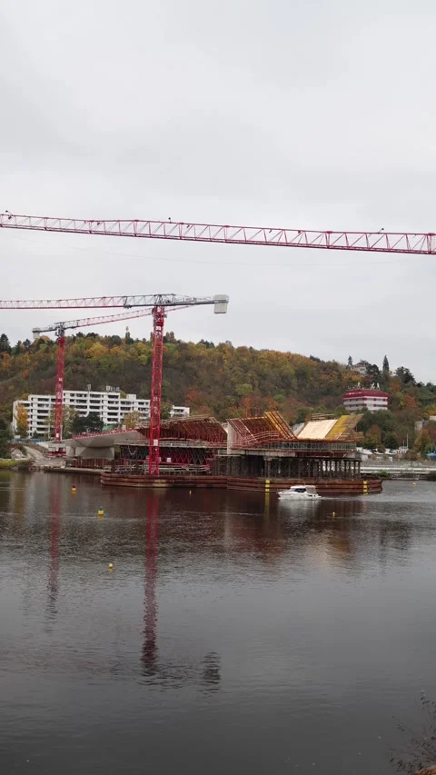 A large construction site with scaffolding and a crane. The framework for a mode Stock Footage 289644931