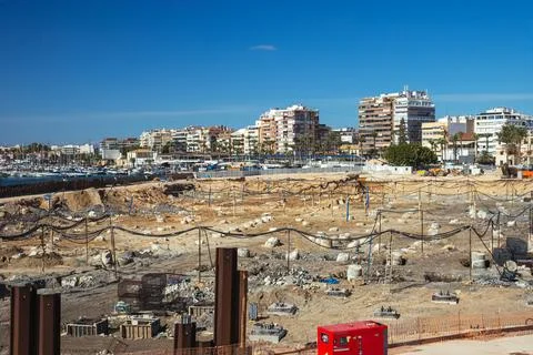 Large construction site on the sea coast, construction concept Stock Photos
