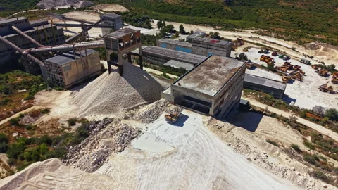 Large construction site shows machinery and materials in production area with Stock Footage 341610997