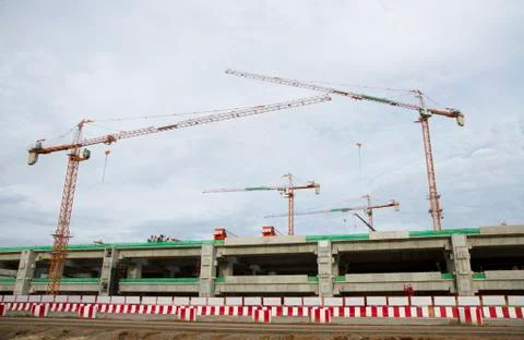 Large construction site with tower crane and blue sky Stock Photos