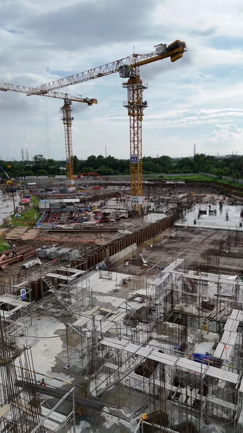Large Construction Site With Tower Cranes and Foundation Reinforcement Video stock 343882195