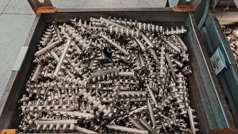 Large container with assembled brass manifolds. Mass production of components Stock Footage 329310914