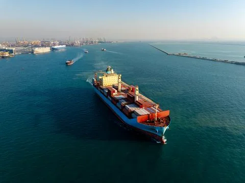 Large Container Cargo Ship Navigating Deep Blue Sea Near Laem Chabang Port .. Stock Photos