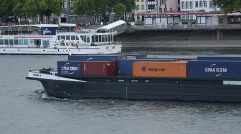 Large Container Cargo Ship Passing Fluvial Boat Rhine River CMA CGM Hapag Lloyd Stock Footage 42999979