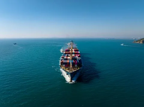 Large Container Cargo Ship Transporting Freight Across Open Sea In Si Racha.. Fotos Stock