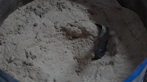 Large container filled with light brown sawdust and small shovel. Stock Footage 343889898