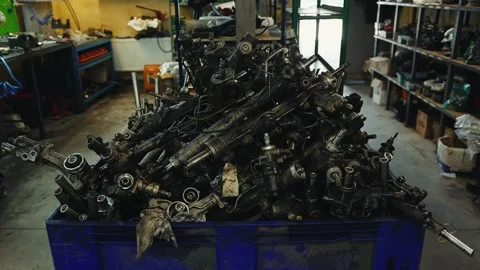 Large container filled with steering racks in a car repair shop Stock Footage 284545380