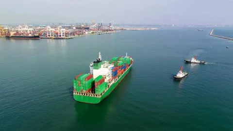 Large Container Ship Approaching Busy Industrial Port In Chon Buri Thailand Photos