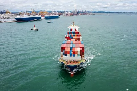 Large Container Ship Approaching Industrial Port Facilities In Thailand For.. Stock Photos
