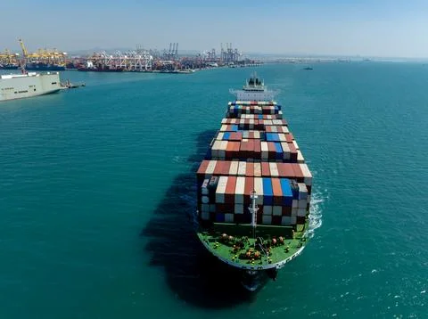 Large Container Ship Approaching Industrial Port Facilities In Laem Chabang.. Stock Photos