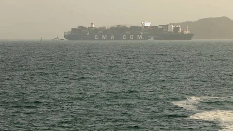 Large container ship arriving at port Stock Footage 85654066