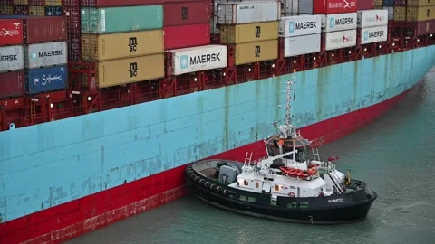 Large Container Ship Assisted By Tugboat Stock Footage 170443282