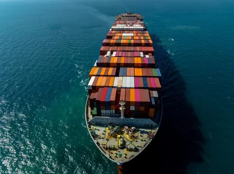 Large Container Ship Carrying Cargo Across The Ocean Near Laem Chabang Thai.. Stock Photos