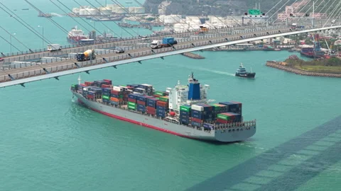 Large Container Ship Docking At A Busy Hong Kong Port, Showcasing Global Trade Stock Footage 316663616