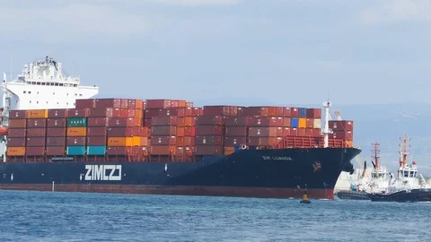 Large container ship entering a sea port 4K Stock Footage 116779585