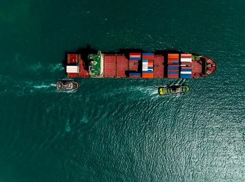 Large Container Ship Escorted By Two Tugboats Navigating Coastal Waters Hig.. 스톡 사진