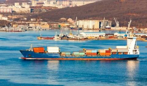 Large container ship in the harbor Stock Photos