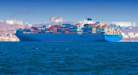 Large container ship in the harbor Stock Photos