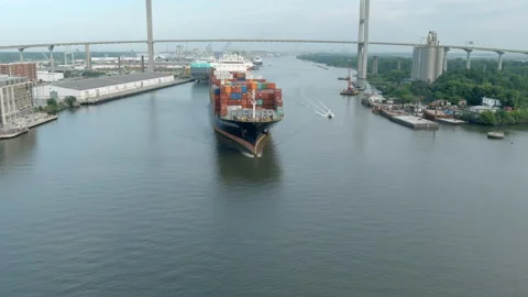 A large container ship leaves the port of Savannah Stock Footage 155131938