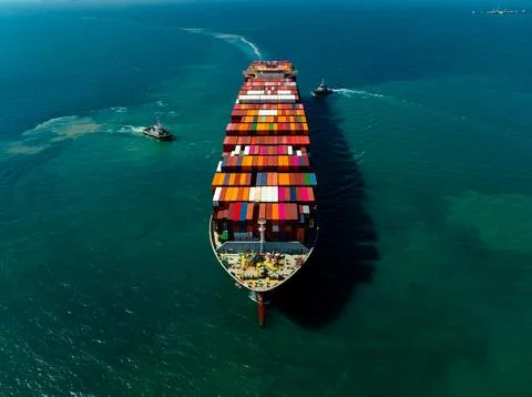 Large Container Ship Maneuvering With Escort Tugboats In The Gulf Of Thaila.. Stock Photos