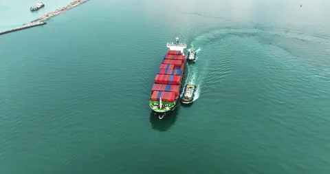 Large Container Ship Navigated By Tugboats In Ocean Waters Near Harbor Port.. Stock-Footage 340327990