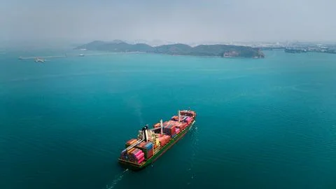 Large Container Ship Navigating Calm Blue Waters Near Si Racha Chon Buri Th.. Stock Photos