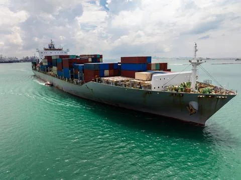 Large Container Ship Navigating Coastal Waters During International Trade T.. Stock Photos