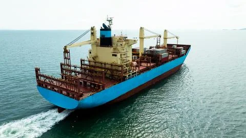 Large Container Ship Navigating Coastal Ocean Waters Near Si Racha Thailand.. Photos