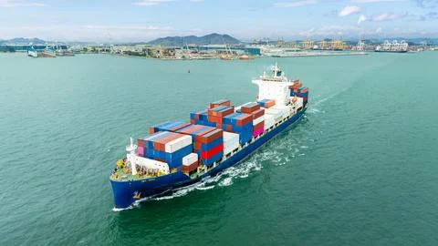 Large Container Ship Navigating Coastal Waters Near Port Terminal Photos